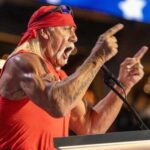 School Board Chair’s SHOCKING Comments Go Viral A muscular man in a red bandana passionately speaking at a podium