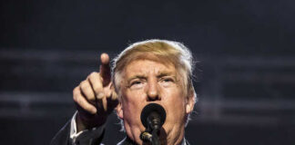 Donald Trump speaking passionately at a rally