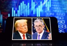 Side-by-side images of two political figures on a smartphone screen with financial graphs in the background