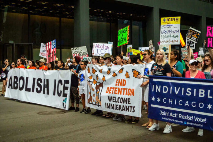 Protesters with banners advocating immigration reform