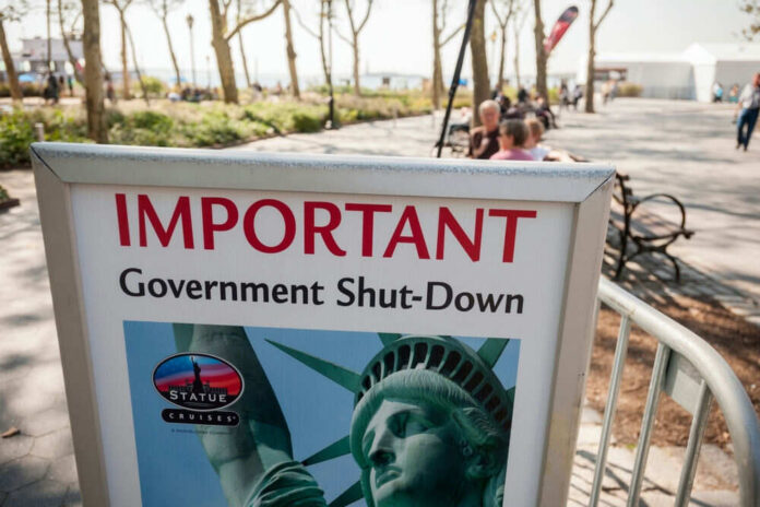 Important government shutdown sign near park walkway