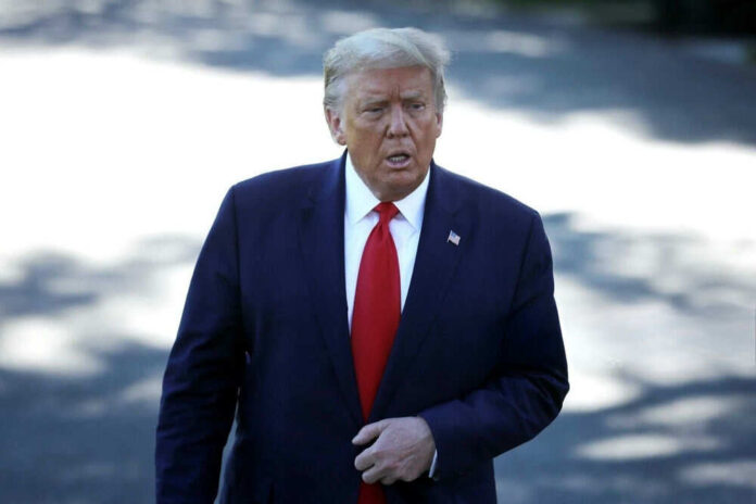 2566318883 Man in suit with red tie walking outside