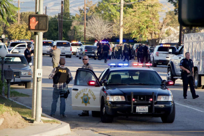 1317752372 Police activity with multiple vehicles and officers present