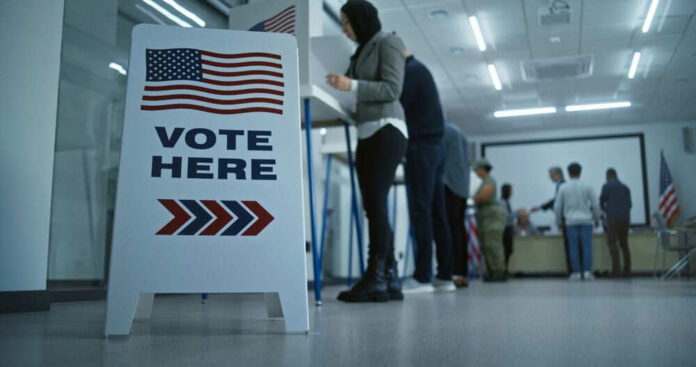 Voting station with sign and people casting ballots