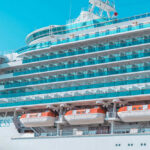 Cruise Ship “Murder” Twist Shocks Florida Courtroom Large white cruise ship with balconies and lifeboats