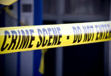 Yellow crime scene do not enter tape closeup