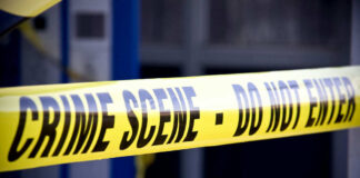 Yellow crime scene do not enter tape closeup
