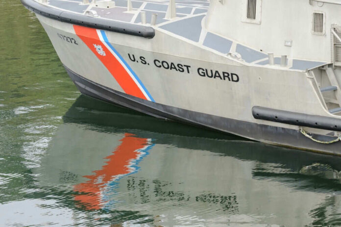 Coast Guard boat with reflection in water
