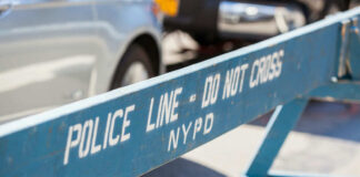 Blue police barricade with do not cross text