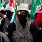 ISIS-Iran Alliance: Jews in Global Crosshairs Soldiers in formation with flags and helmets visible