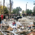 Rescue workers clearing debris after building collapse