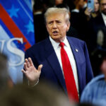 PANIC: Media Scrambles Against Trump’s Affordability Tour Man in suit speaking at a crowded event