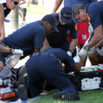 Barefoot Father TRAPPED With Hungry Alligators Emergency responders assisting person on grass lawn