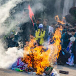 Massive Protests Engulf Iran — Thousands Dead