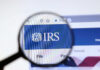Magnifying glass over IRS website logo