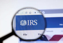 Magnifying glass over IRS website logo