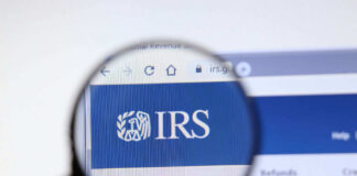 Magnifying glass over IRS website logo