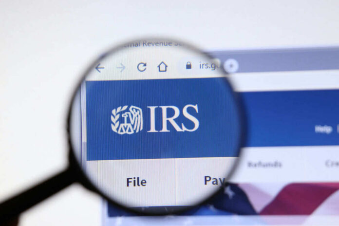 Magnifying glass over IRS website logo