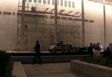 Trump name on Kennedy Center: Crowd chants for workers to 'take it down' after clock hits midnight